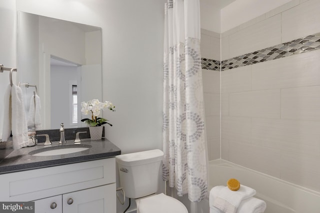 full bathroom featuring vanity, toilet, and shower / bath combo with shower curtain