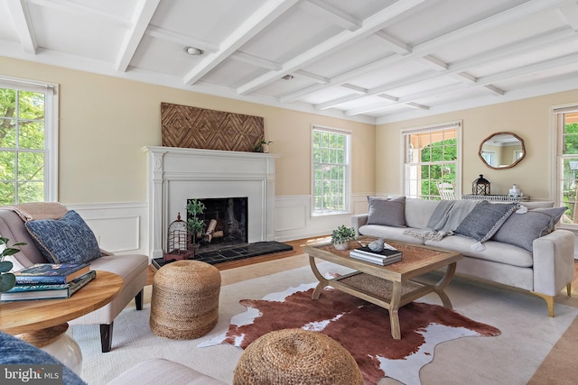 living room featuring coffered ceiling and beamed ceiling