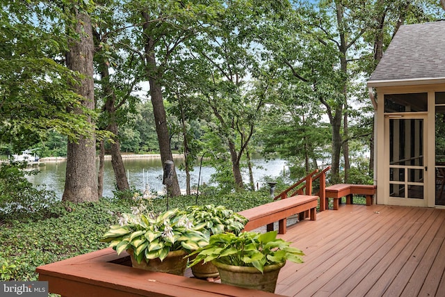 deck featuring a water view