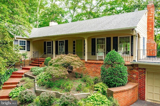 single story home with a porch