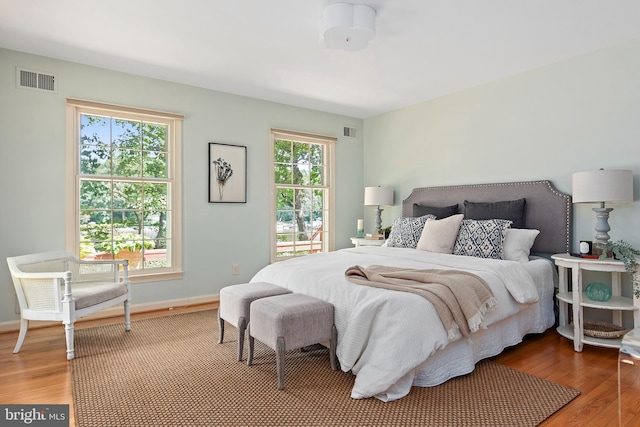 bedroom with wood-type flooring