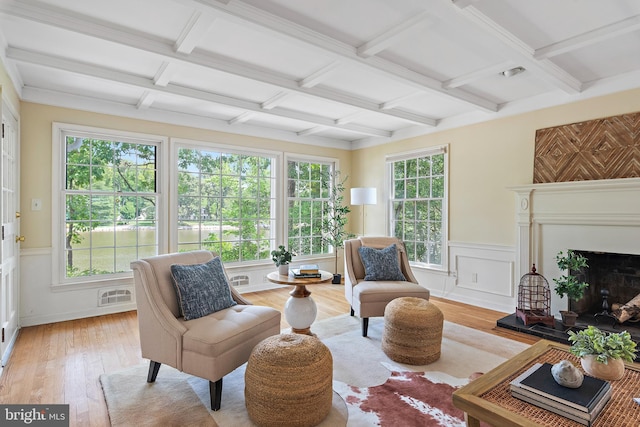 interior space featuring coffered ceiling and beamed ceiling