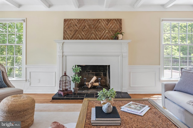 living room featuring hardwood / wood-style flooring and beam ceiling