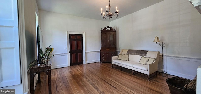 unfurnished room featuring dark hardwood / wood-style floors and a chandelier