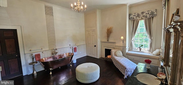 interior space featuring a chandelier, dark hardwood / wood-style floors, and crown molding