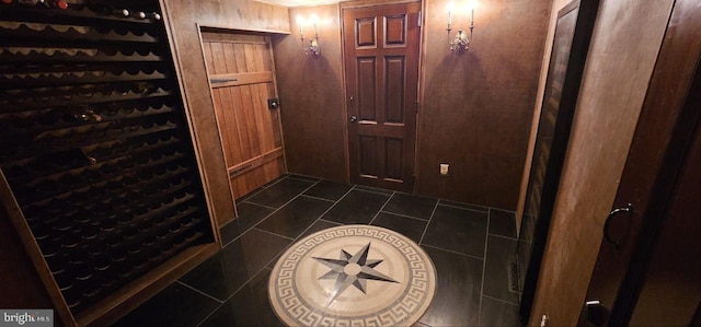 wine area featuring dark tile patterned flooring