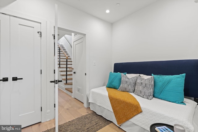 bedroom featuring a closet and light wood-type flooring