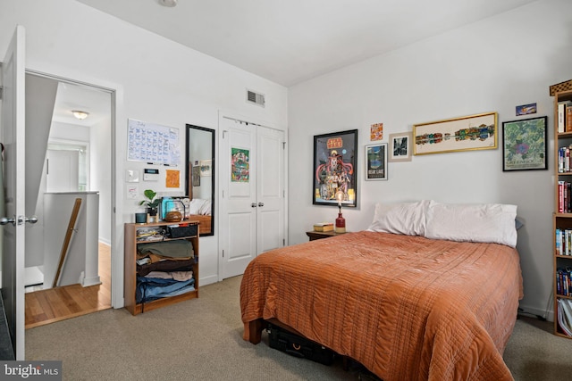 carpeted bedroom featuring a closet