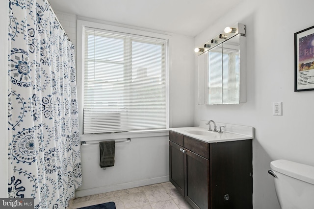 bathroom with vanity, toilet, and a shower with shower curtain