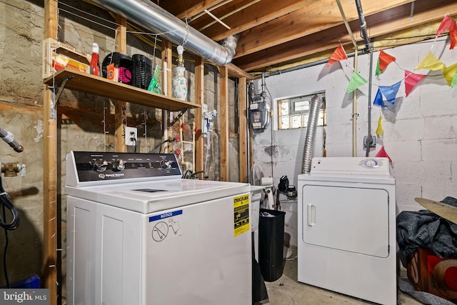 laundry area with independent washer and dryer