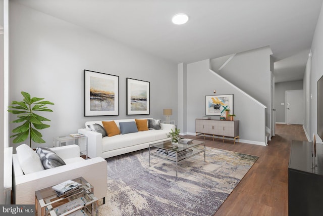 living room with dark hardwood / wood-style floors