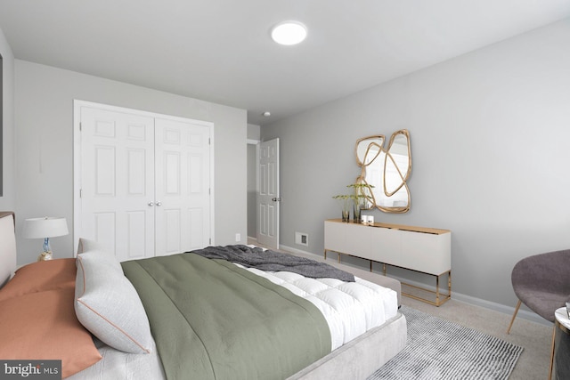 carpeted bedroom featuring a closet