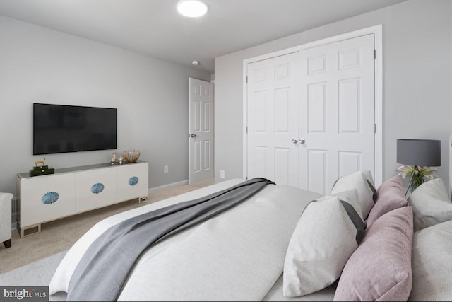 carpeted bedroom with a closet