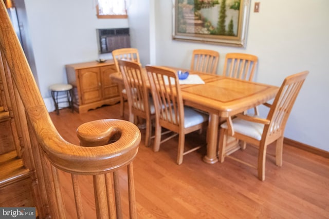 dining area featuring light hardwood / wood-style flooring and cooling unit