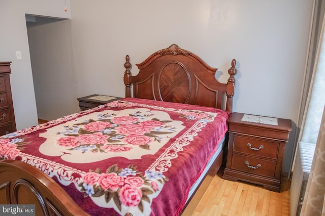 bedroom with light hardwood / wood-style flooring