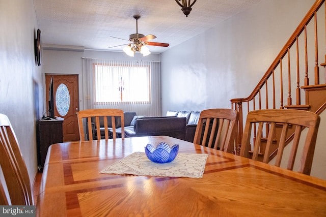 dining space featuring ceiling fan