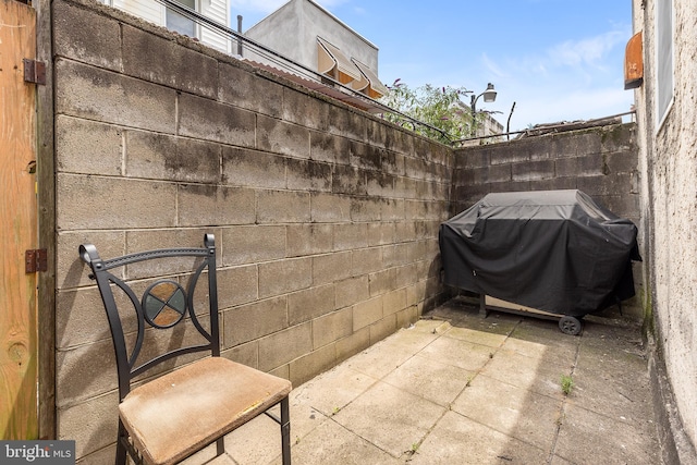 view of patio with a grill