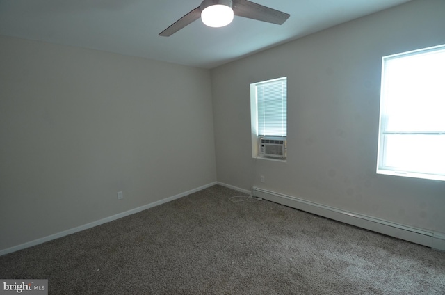 carpeted spare room with a healthy amount of sunlight, cooling unit, a baseboard radiator, and ceiling fan