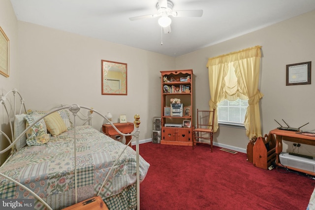 bedroom featuring ceiling fan and carpet