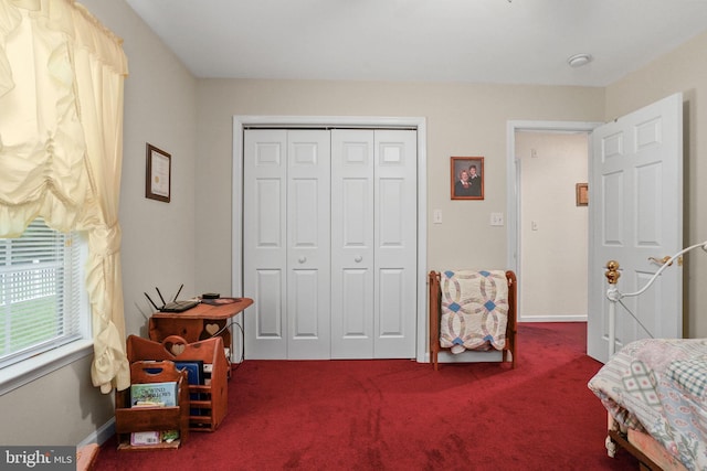 bedroom with carpet and a closet