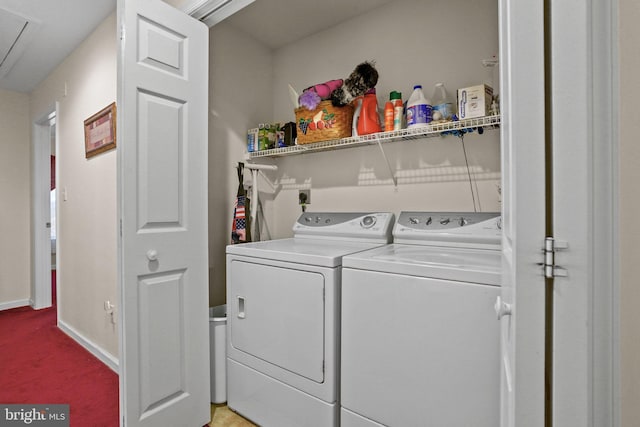 washroom with light colored carpet and washing machine and dryer