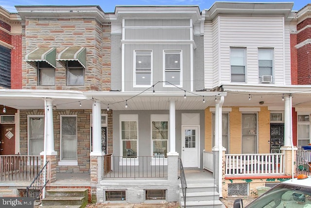 view of property with covered porch