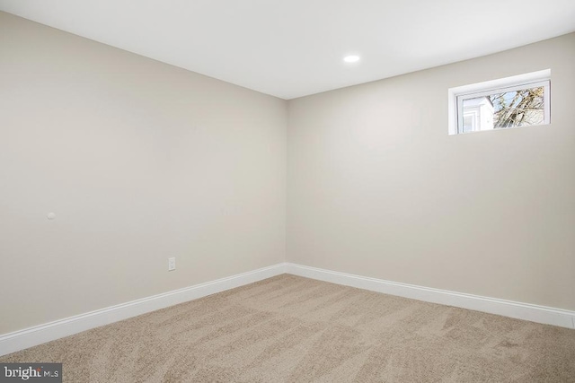 carpeted empty room with recessed lighting and baseboards