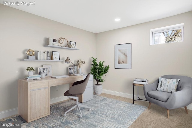 home office featuring light colored carpet and baseboards