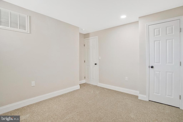 unfurnished bedroom with light carpet, recessed lighting, visible vents, and baseboards