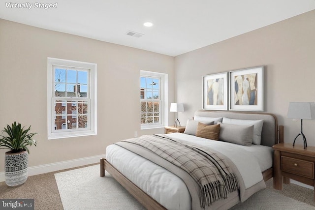 bedroom with carpet floors, baseboards, visible vents, and recessed lighting