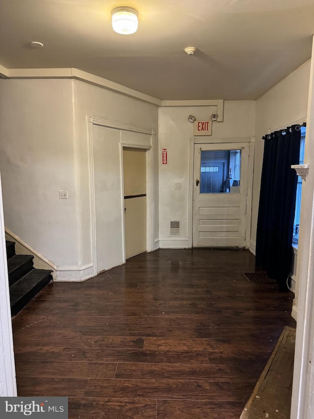 unfurnished living room featuring wood-type flooring