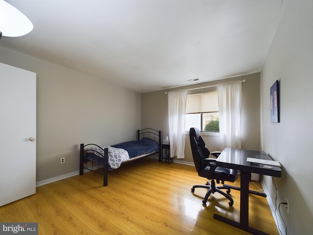 bedroom with light wood-type flooring