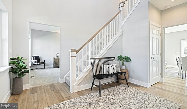 interior space featuring light colored carpet