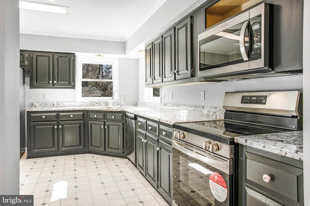 kitchen with crown molding, stainless steel appliances, sink, and light stone counters