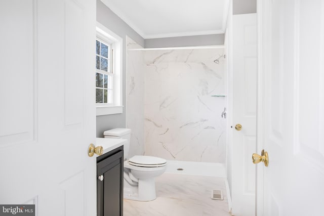 bathroom featuring crown molding, vanity, toilet, and a tile shower