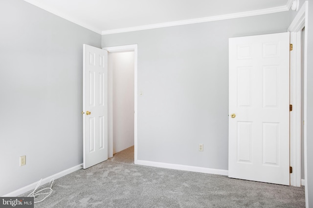 unfurnished bedroom featuring light colored carpet and ornamental molding
