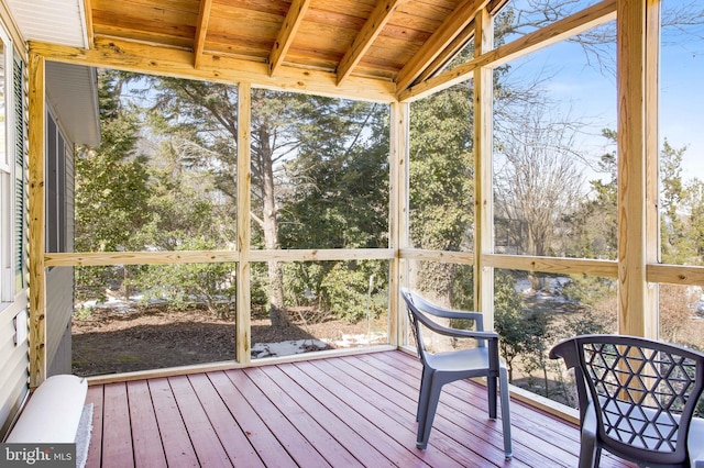 sunroom / solarium with wooden ceiling and vaulted ceiling with beams