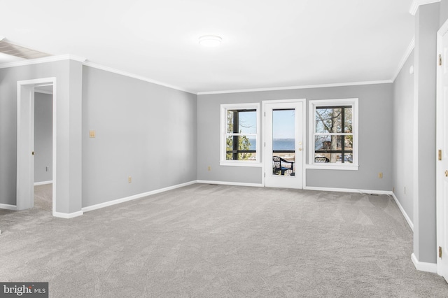 unfurnished living room featuring crown molding and light colored carpet
