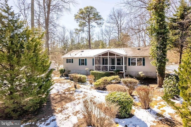 view of front of property with a sunroom