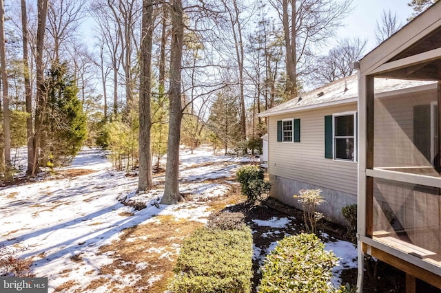 view of yard covered in snow