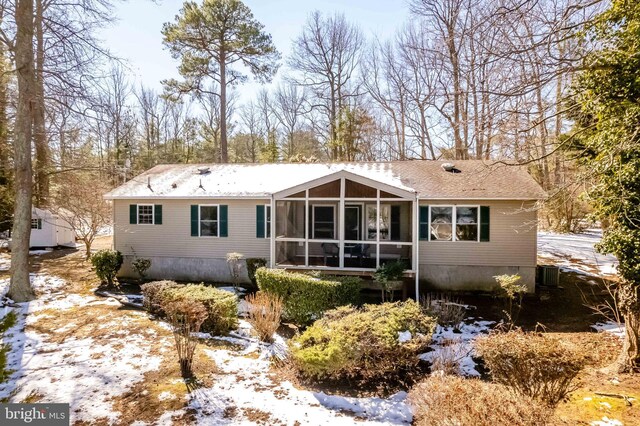 view of front of house with a sunroom