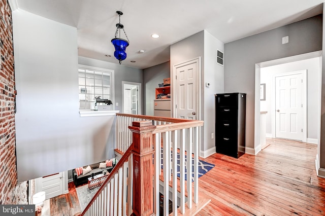 hallway featuring hardwood / wood-style floors