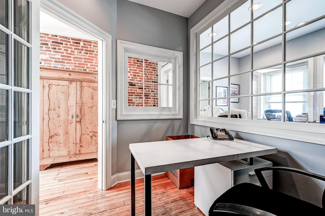 home office with hardwood / wood-style floors