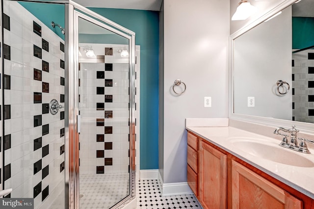 bathroom featuring vanity and a shower with shower door