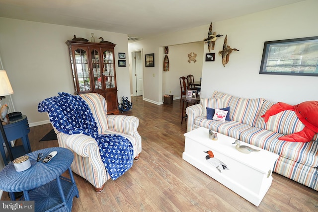 living room with light hardwood / wood-style flooring