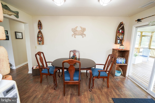 dining space with dark wood-type flooring