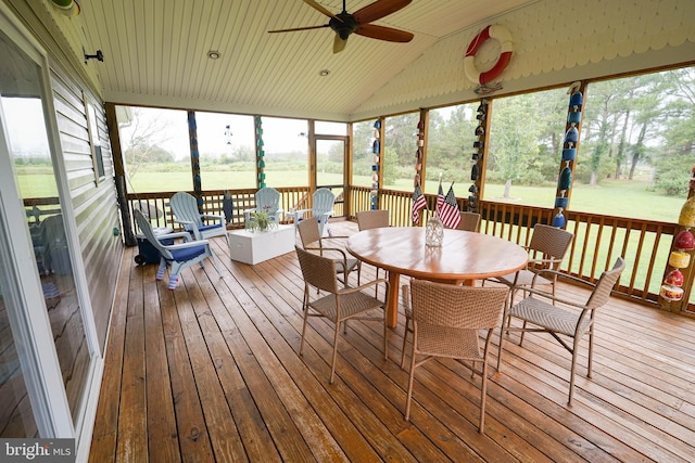 sunroom / solarium featuring lofted ceiling