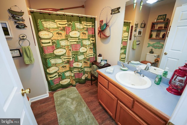 bathroom with vanity and hardwood / wood-style flooring