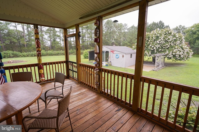 wooden deck with a lawn