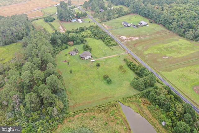 drone / aerial view featuring a rural view and a water view